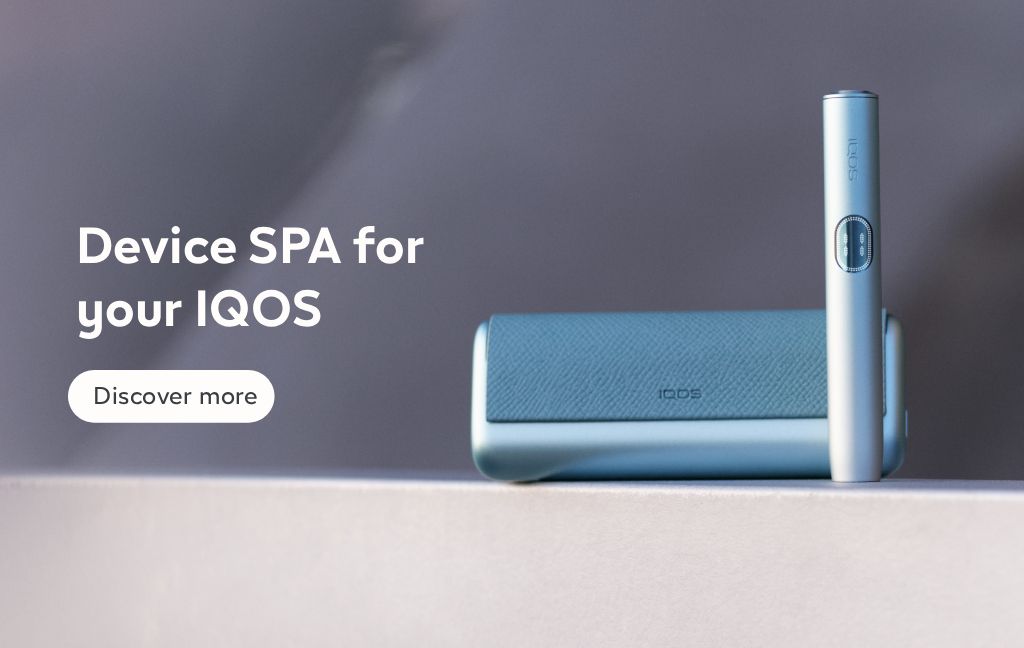 IQOS ILUMA i PRIME Breeze blue color holder and pocket charger in the grey background with the text Device SPA for your IQOS and button Discover more.