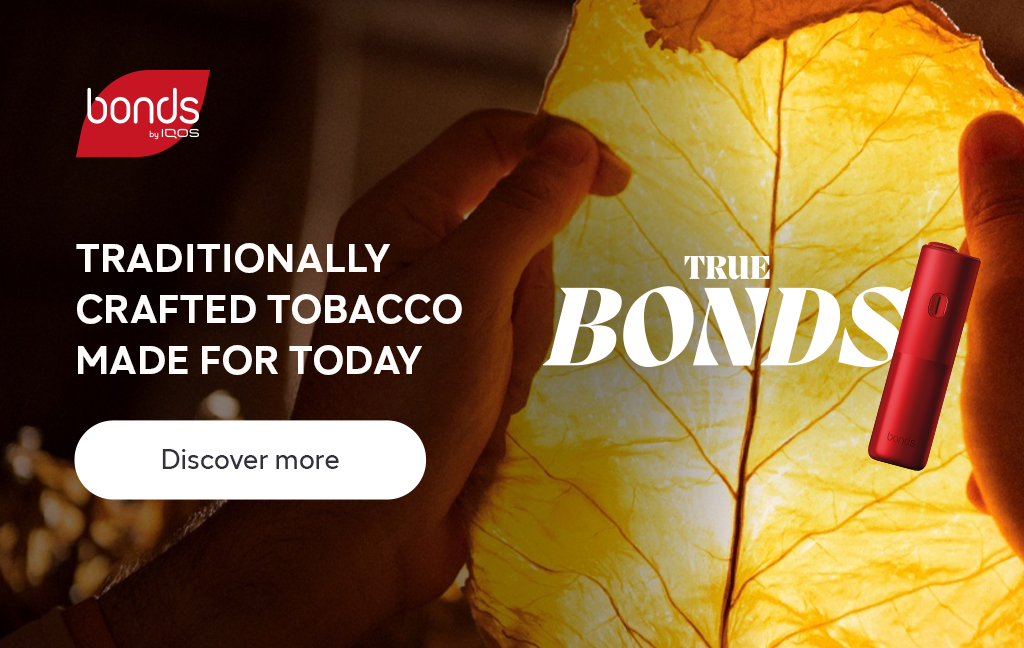 BONDS by IQOS device displayed in front of a tobacco leaf.​
