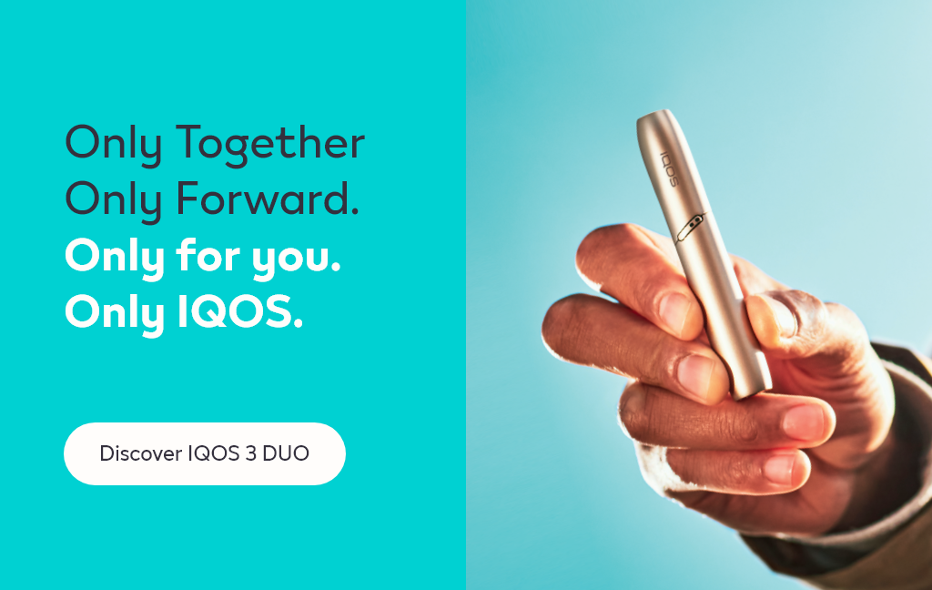 A person holding an IQOS device.